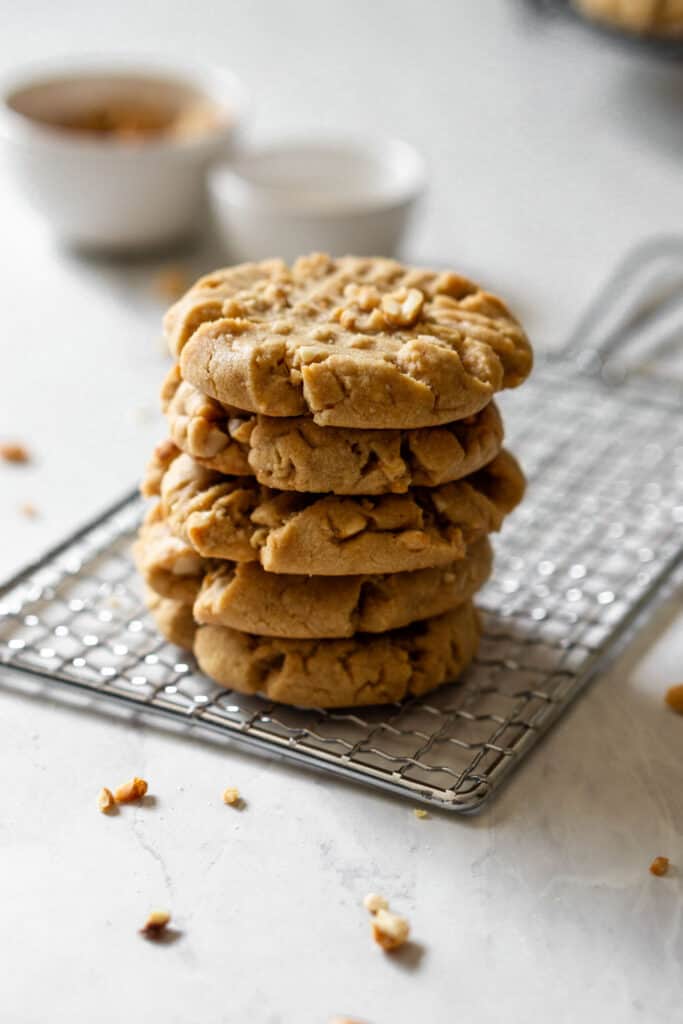 Stack of peanut butter cookies on a cooling rack
