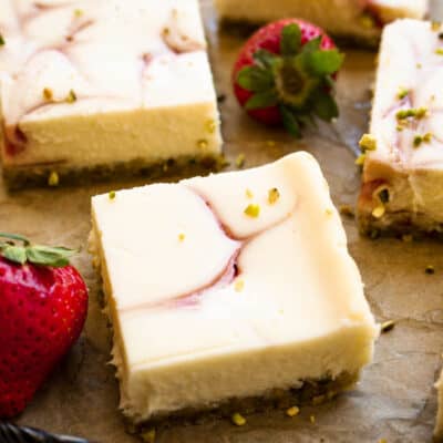 Straight on picture of strawberry pistachio cheesecake bars
