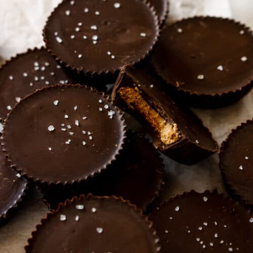 Chocolate almond butter cups on parchment paper