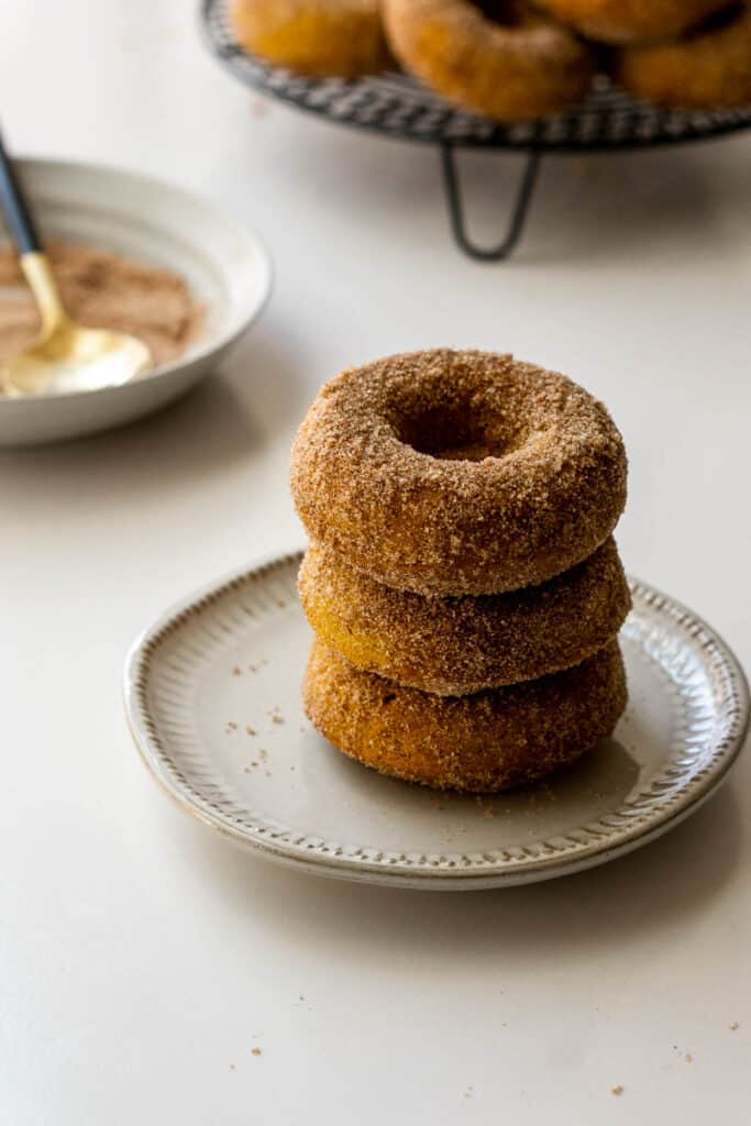Baked pumpkin donuts on serving plate